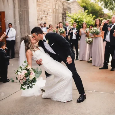 A groom dips his bride.