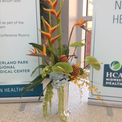 A tall tropical floral arrangement.